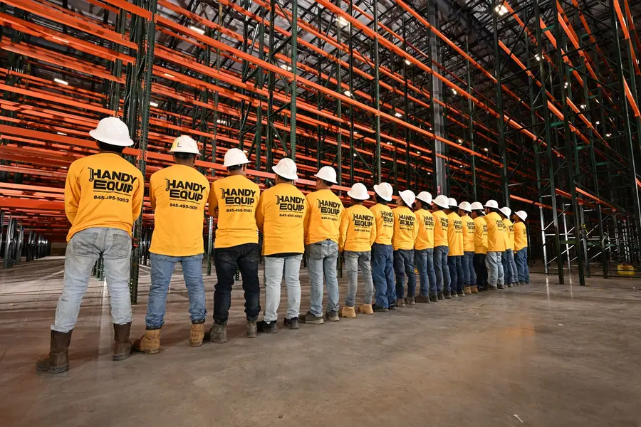 Full team group photo in warehouse