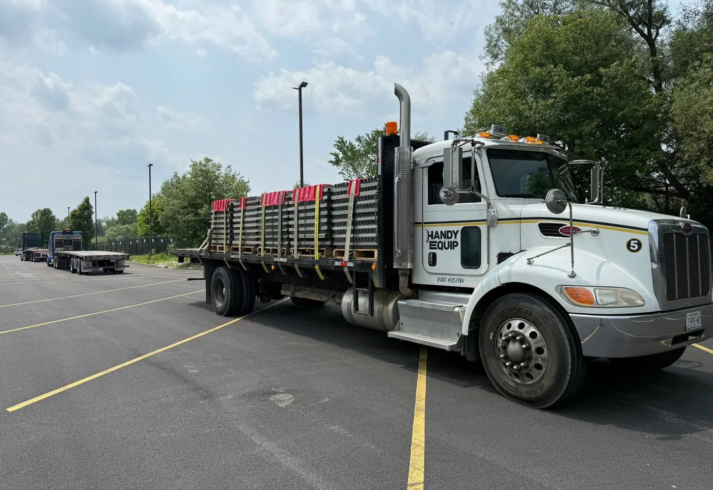 Handy Equip flatbed loaded with racking